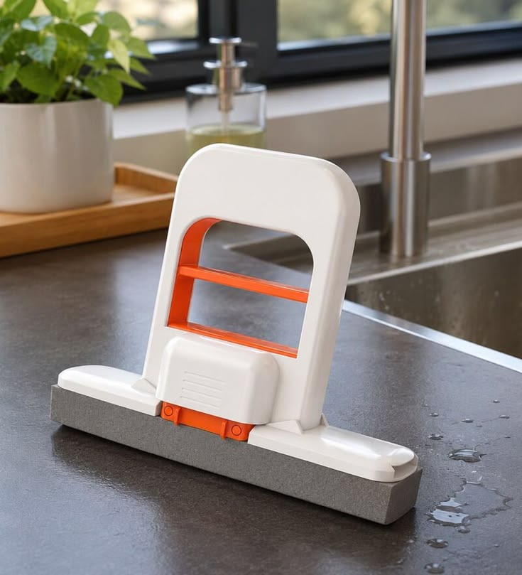 Compact, portable, and self-squeezing cleaning tool designed for effortless desktop, kitchen, and bathroom cleanup.